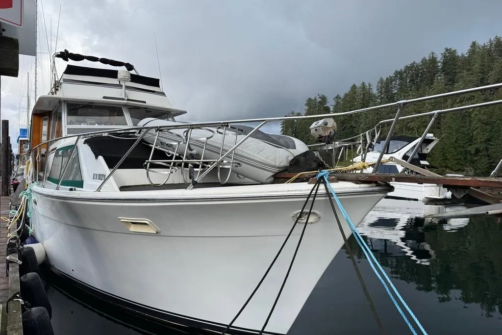 1977 Pacemaker 40 Motor Yacht docked in a serene marina setting.