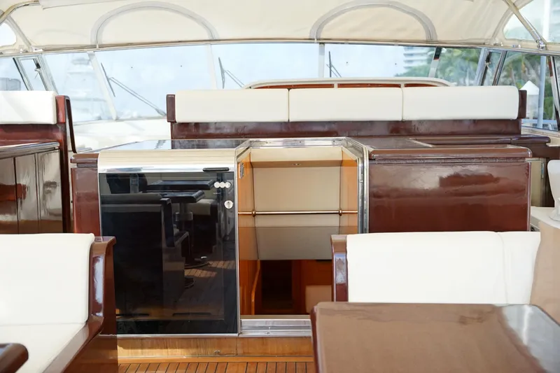  Yacht Photos Pics Luxurious interior of a 1999 Mangusta 80 yacht with elegant wood finishes.