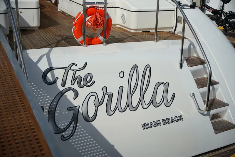  Yacht Photos Pics 1999 Mangusta 80 yacht "The Gorilla" docked at Miami Beach with lifebuoy.