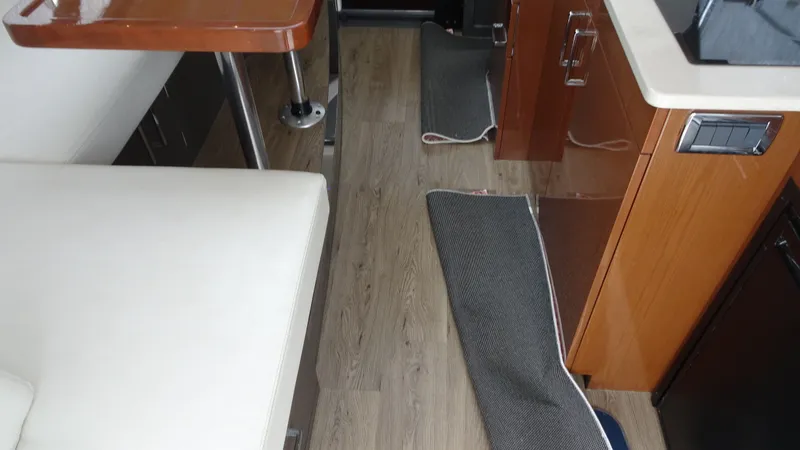 Sc Yacht Photos Pics Interior of 2018 Carver C34 Coupe with wood flooring and modern furnishings.