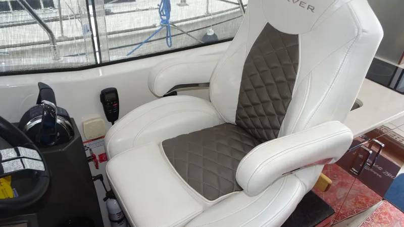 Sc Yacht Photos Pics Captain's chair in 2018 Carver C34 Coupe, featuring quilted upholstery and armrests.