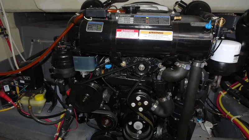 Sc Yacht Photos Pics Engine compartment of a 2018 Carver C34 Coupe, showcasing detailed mechanical components.