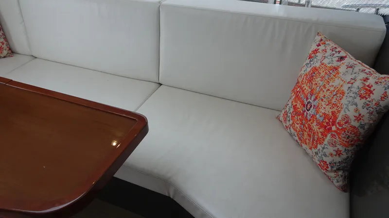 Sc Yacht Photos Pics Interior of 2018 Carver C34 Coupe with white seating and decorative pillow.