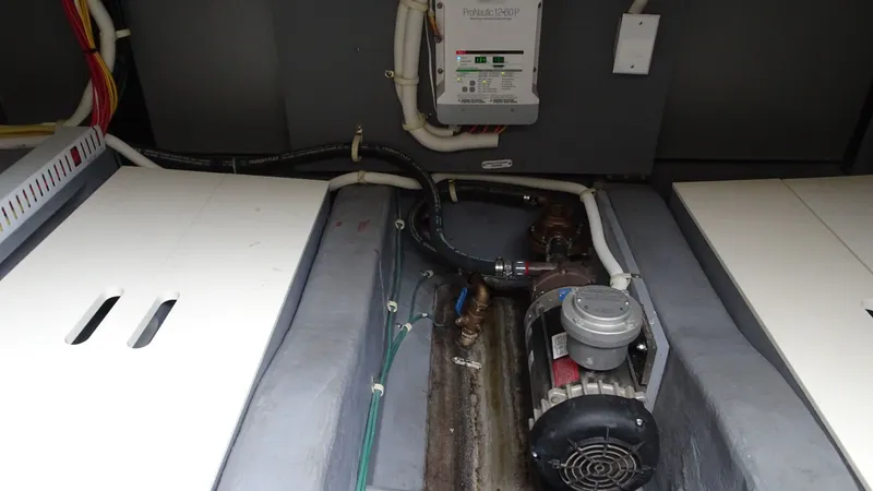 Sc Yacht Photos Pics Engine compartment of 2018 Carver C34 Coupe with visible wiring and machinery components.