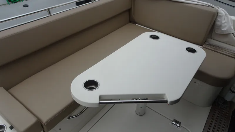 Sc Yacht Photos Pics 2018 Carver C34 Coupe interior with beige seating and a white table.