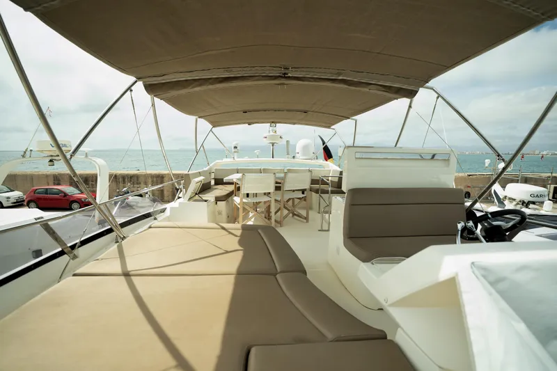  Yacht Photos Pics Luxurious 2014 Prestige 550 yacht deck with seating and ocean view.