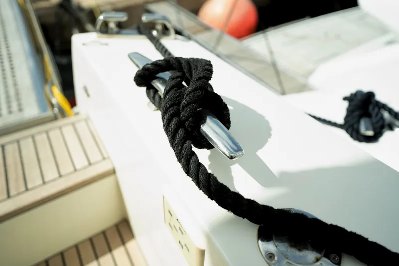  Yacht Photos Pics Black rope tied on a cleat of a 2014 Prestige 550 yacht.