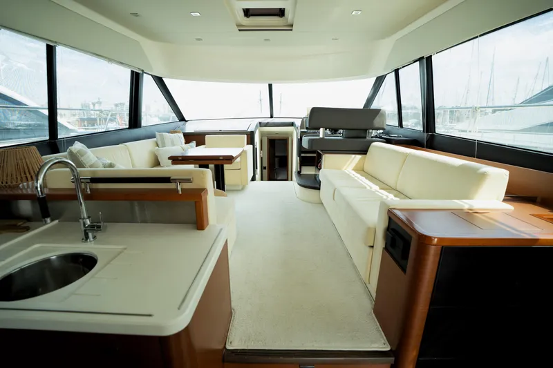  Yacht Photos Pics Luxurious interior of a 2014 Prestige 550 yacht with elegant seating and modern amenities.