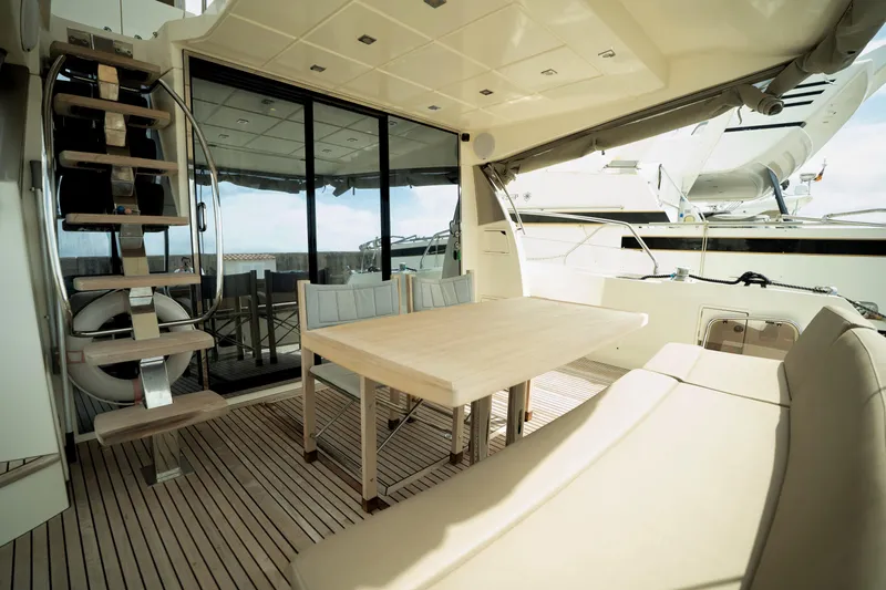  Yacht Photos Pics Luxurious 2014 Prestige 550 yacht interior with elegant seating and dining area.