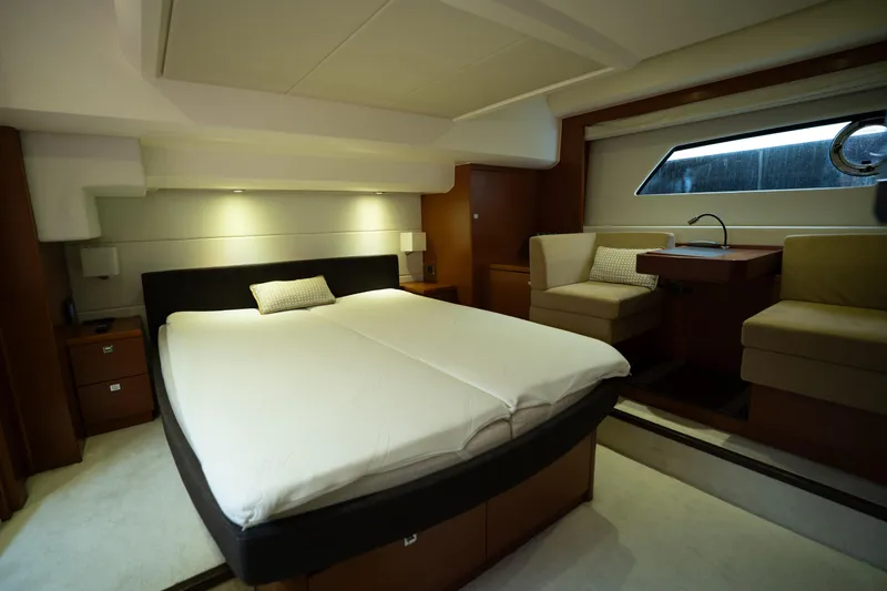  Yacht Photos Pics Luxurious cabin interior of a 2014 Prestige 550 yacht with modern furnishings.