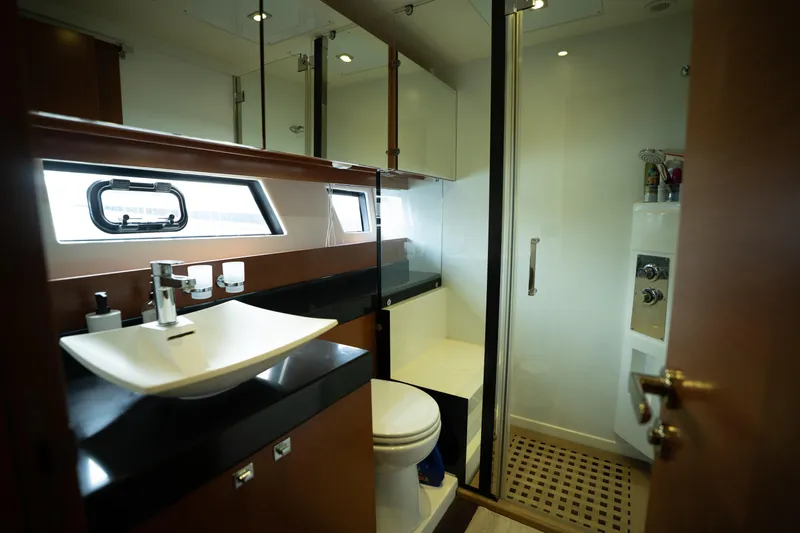  Yacht Photos Pics Luxurious bathroom in a 2014 Prestige 550 yacht, featuring modern fixtures and elegant design.