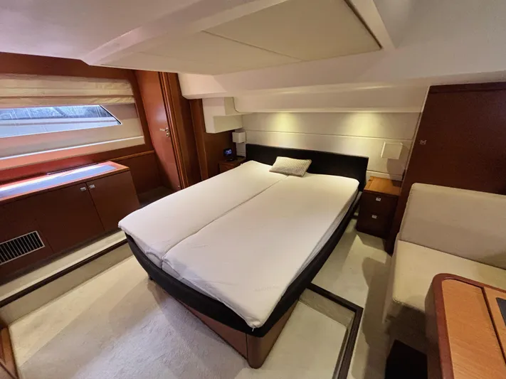  Yacht Photos Pics Luxurious cabin interior of a 2014 Prestige 550 yacht with a comfortable bed.