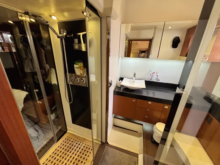  Yacht Photos Pics Luxurious bathroom interior of 2014 Prestige 550 yacht with modern shower and vanity.