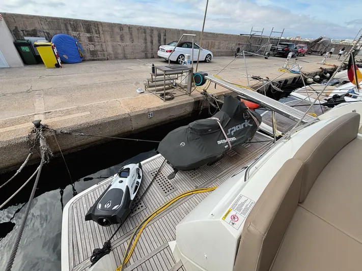  Yacht Photos Pics Prestige 550 yacht docked with jet ski and equipment on deck, 2014 model.