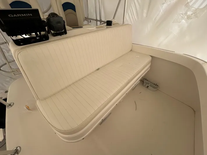  Yacht Photos Pics 2007 Luhrs 36 Convertible boat interior with white seating and Garmin equipment.
