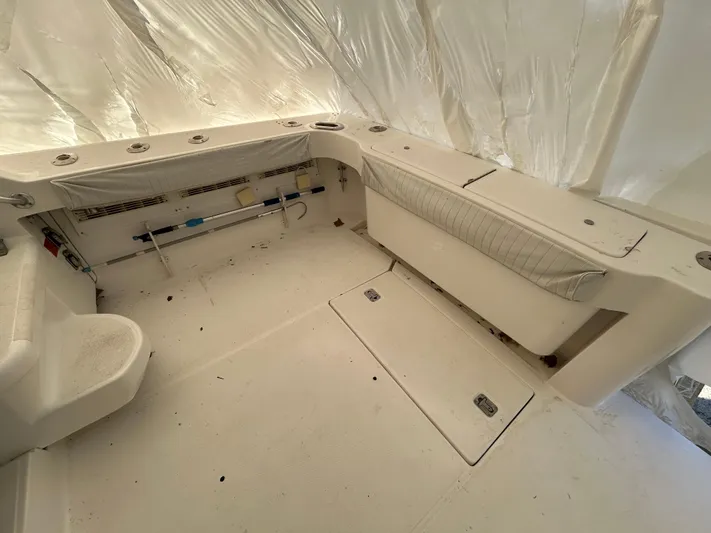  Yacht Photos Pics 2007 Luhrs 36 Convertible boat interior with storage compartments and seating.