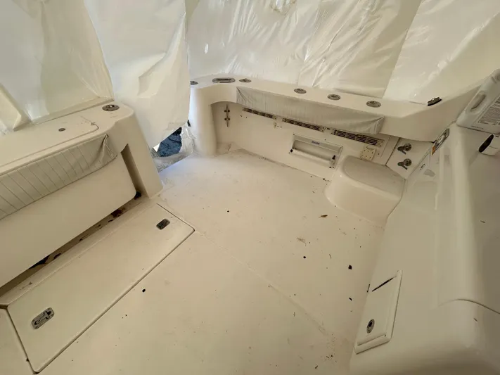  Yacht Photos Pics 2007 Luhrs 36 Convertible boat interior with white seating and storage compartments.