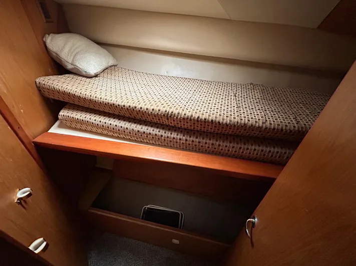  Yacht Photos Pics 2007 Luhrs 36 Convertible cabin interior with bunk bed and storage space.