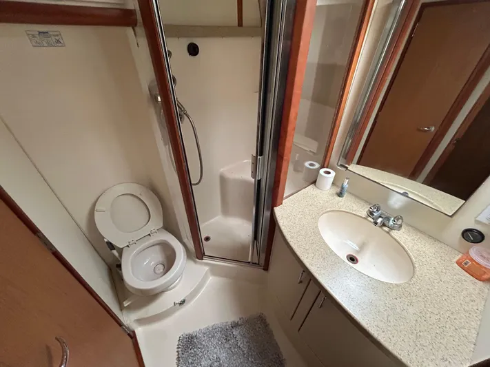 Yacht Photos Pics Bathroom interior of 2007 Luhrs 36 Convertible yacht with shower, sink, and toilet.