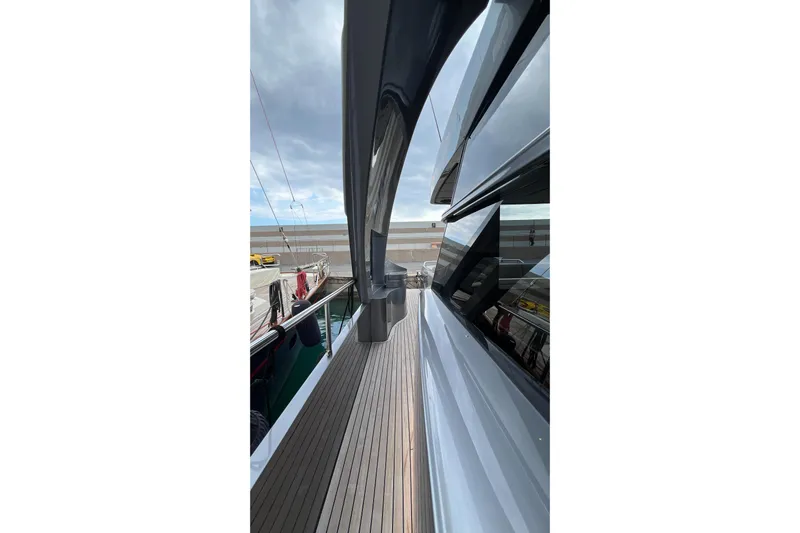  Yacht Photos Pics Side view of 2024 Pershing 8X yacht with sleek design and wooden deck.
