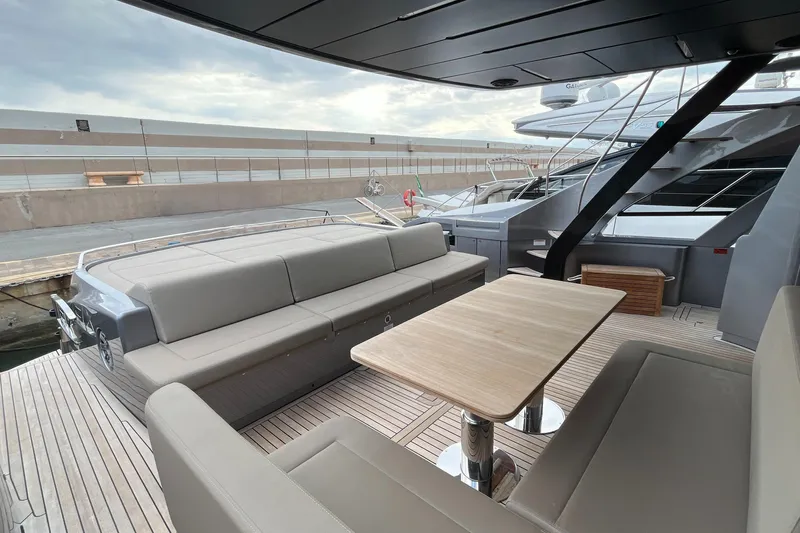  Yacht Photos Pics Luxurious 2024 Pershing 8X yacht deck with elegant seating and table.