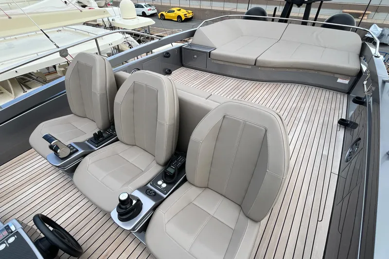  Yacht Photos Pics Luxurious 2024 Pershing 8X yacht interior with sleek seating and modern controls.