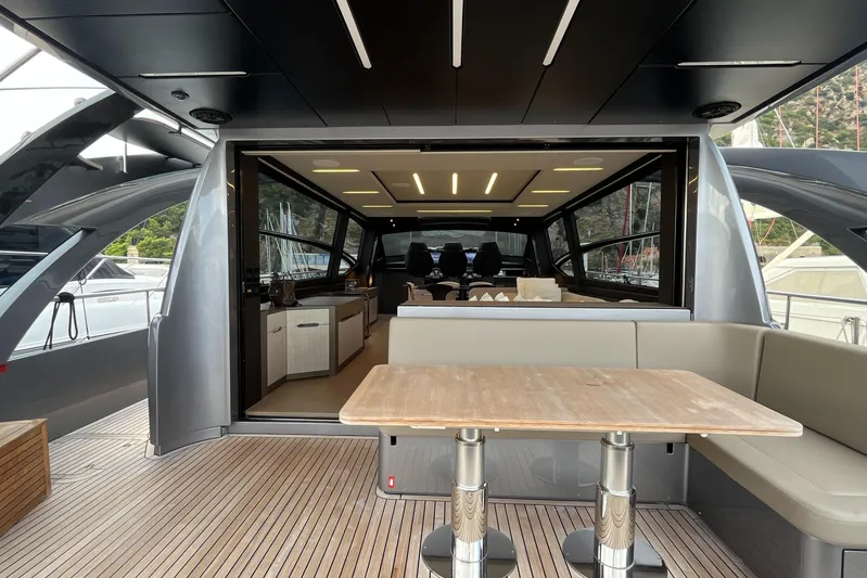  Yacht Photos Pics 2024 Pershing 8X yacht interior with modern design and spacious seating area.