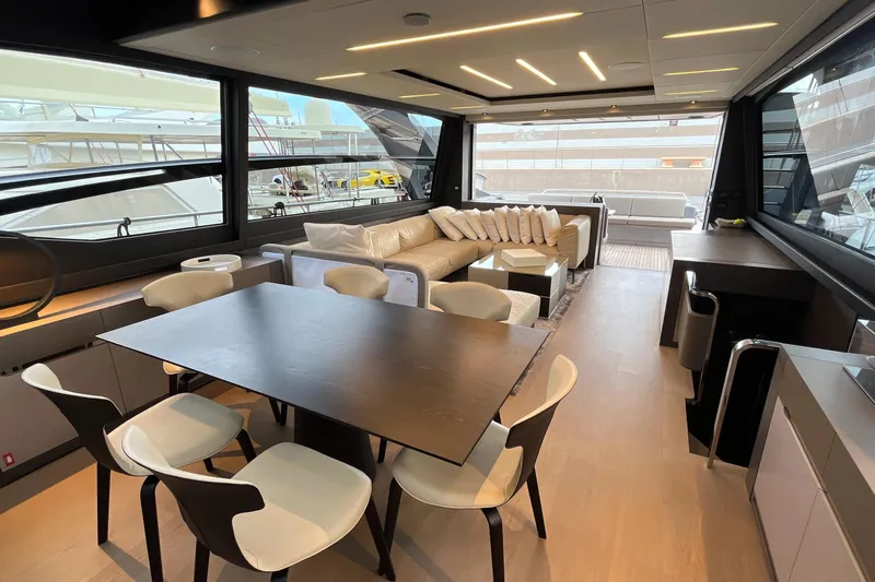  Yacht Photos Pics Luxurious interior of 2024 Pershing 8X yacht with modern dining and seating area.