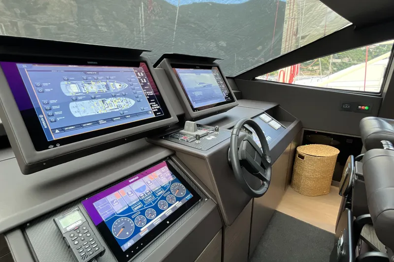  Yacht Photos Pics 2024 Pershing 8X yacht cockpit with advanced navigation screens and controls.