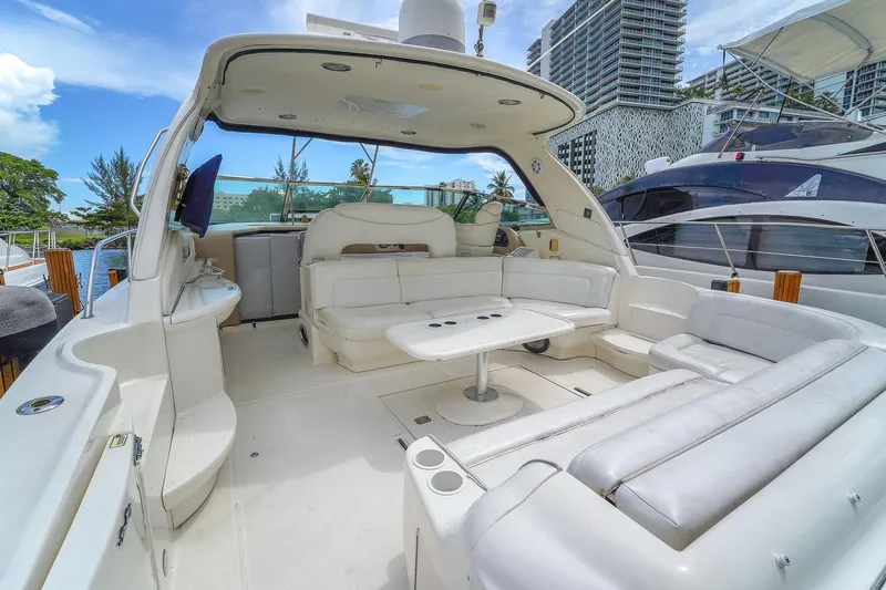  Yacht Photos Pics Luxurious 2004 Sea Ray 460 Sundancer yacht with spacious white seating and modern amenities.