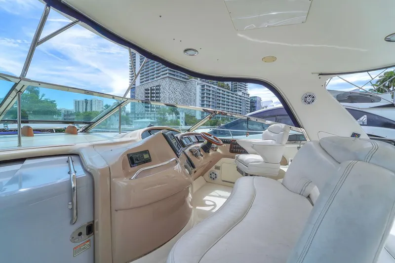  Yacht Photos Pics 2004 Sea Ray 460 Sundancer yacht interior with modern helm and luxurious seating.