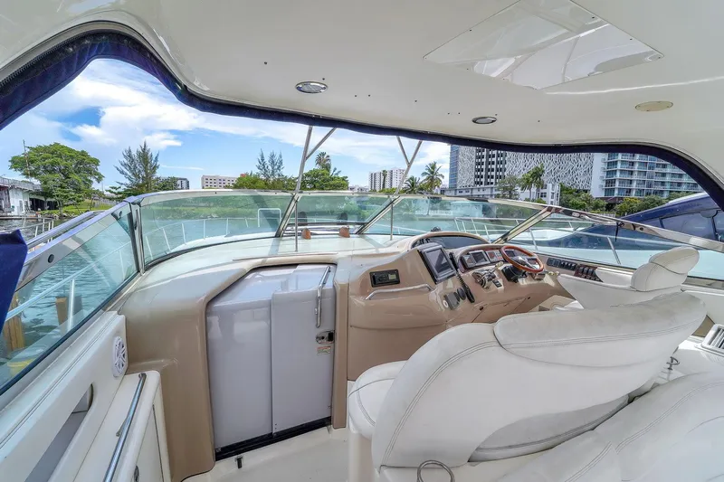  Yacht Photos Pics 2004 Sea Ray 460 Sundancer yacht cockpit with luxurious seating and modern controls.