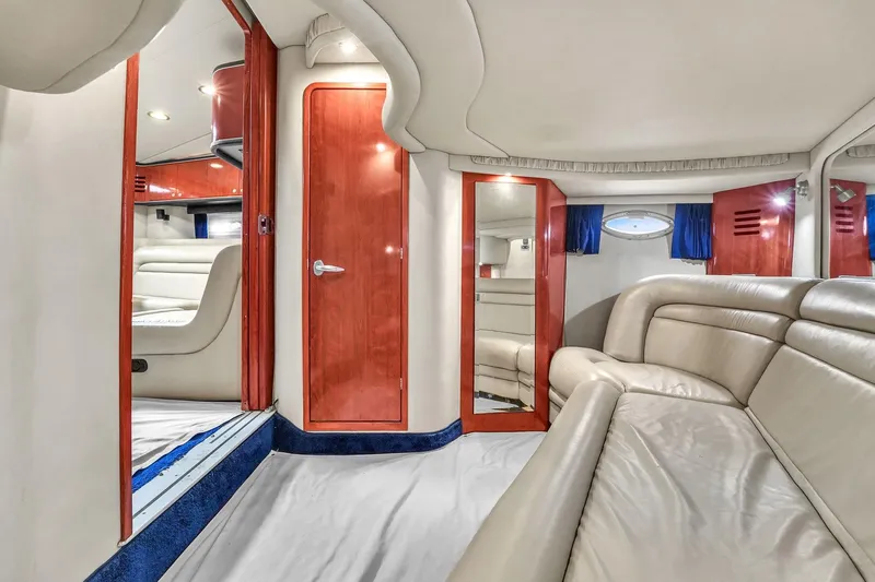  Yacht Photos Pics 2004 Sea Ray 460 Sundancer interior with beige leather seating and wooden accents.