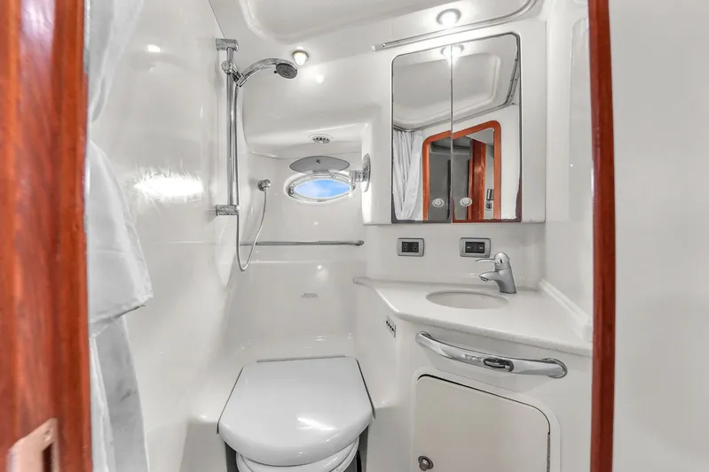  Yacht Photos Pics Luxurious bathroom in 2004 Sea Ray 460 Sundancer yacht with shower and vanity.