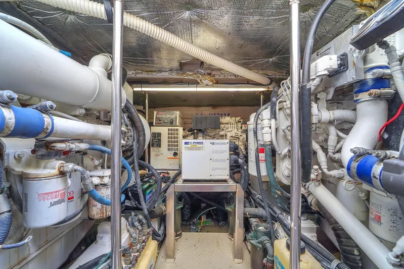  Yacht Photos Pics Engine room of a 2004 Sea Ray 460 Sundancer with mechanical equipment and piping.