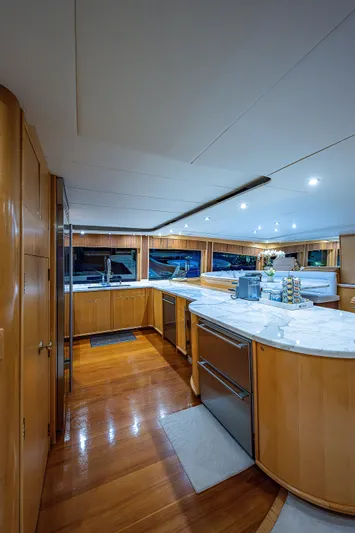 Wire We Here Yacht Photos Pics Luxurious kitchen interior of 1995 Crescent Westport Pilothouse yacht with modern amenities.