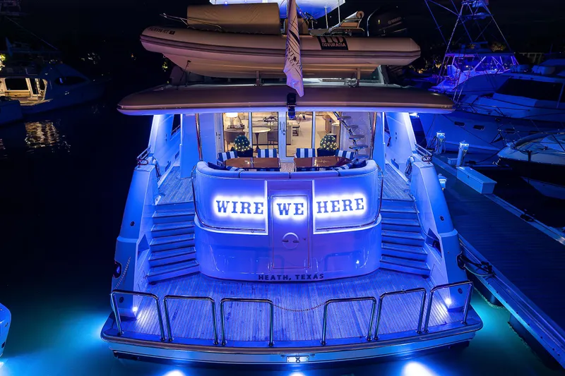 Wire We Here Yacht Photos Pics 1995 Crescent Westport Pilothouse yacht with blue LED lights at night.