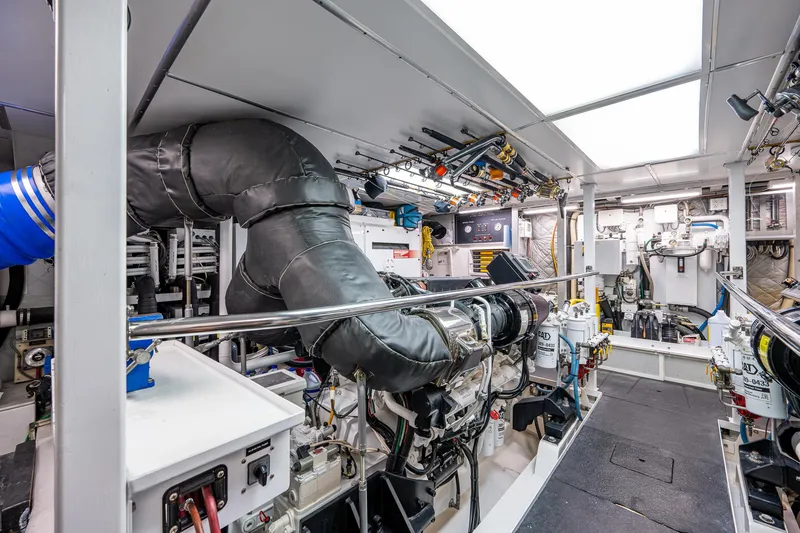 Wire We Here Yacht Photos Pics Engine room of a 1995 Crescent Westport Pilothouse yacht, showcasing machinery and equipment.