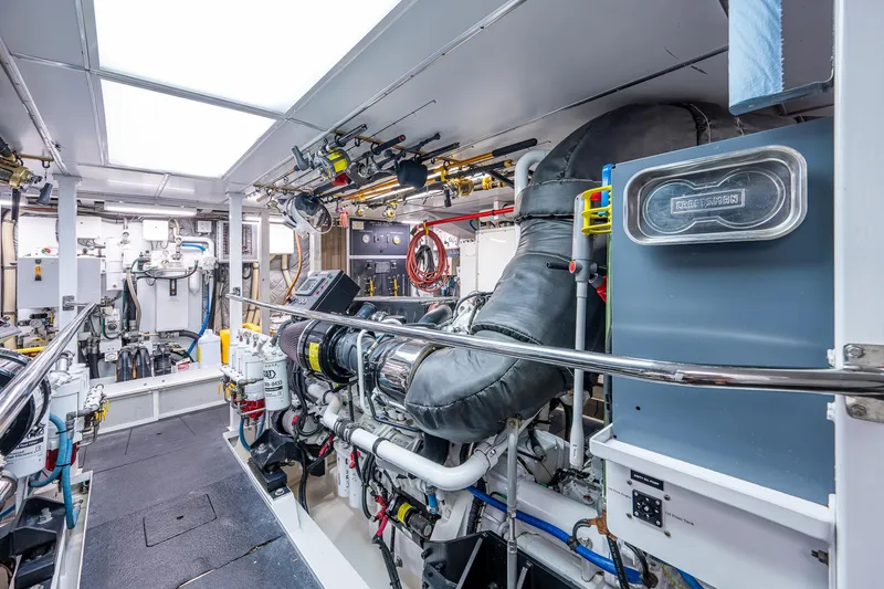 Wire We Here Yacht Photos Pics Engine room of a 1995 Crescent Westport Pilothouse yacht with various mechanical components.