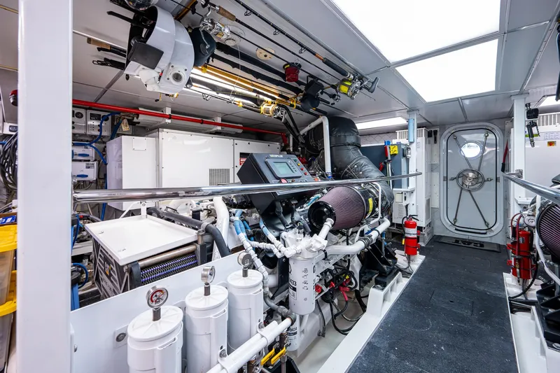 Wire We Here Yacht Photos Pics Engine room of 1995 Crescent Westport Pilothouse yacht with modern equipment and machinery.