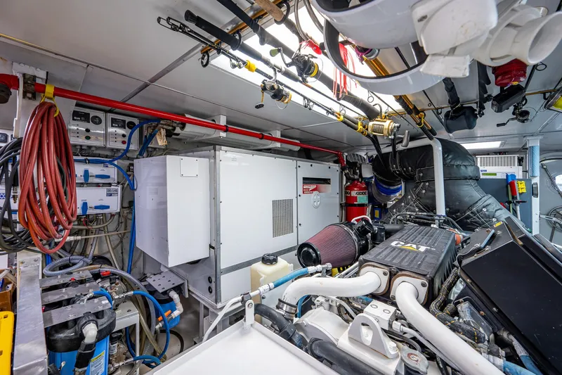 Wire We Here Yacht Photos Pics Engine room of a 1995 Crescent Westport Pilothouse yacht with various mechanical components.