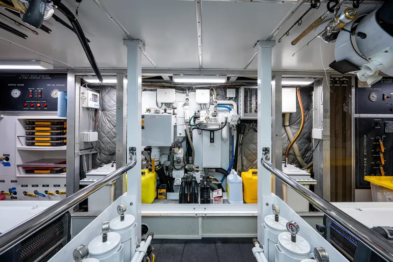 Wire We Here Yacht Photos Pics Engine room of a 1995 Crescent Westport Pilothouse yacht with various machinery and equipment.