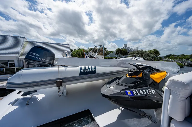 Wire We Here Yacht Photos Pics Crescent Westport Pilothouse 1995 yacht with Novurania tender and jet ski on deck.