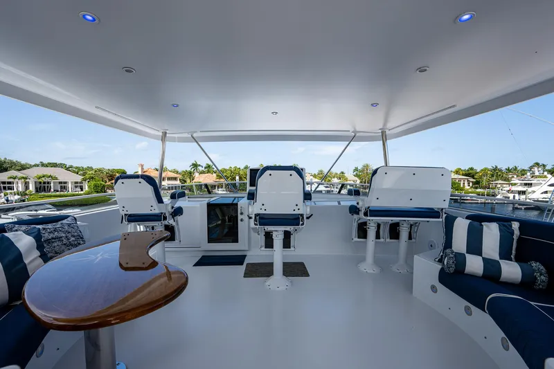 Wire We Here Yacht Photos Pics Spacious deck of 1995 Crescent Westport Pilothouse yacht with seating and helm chairs.