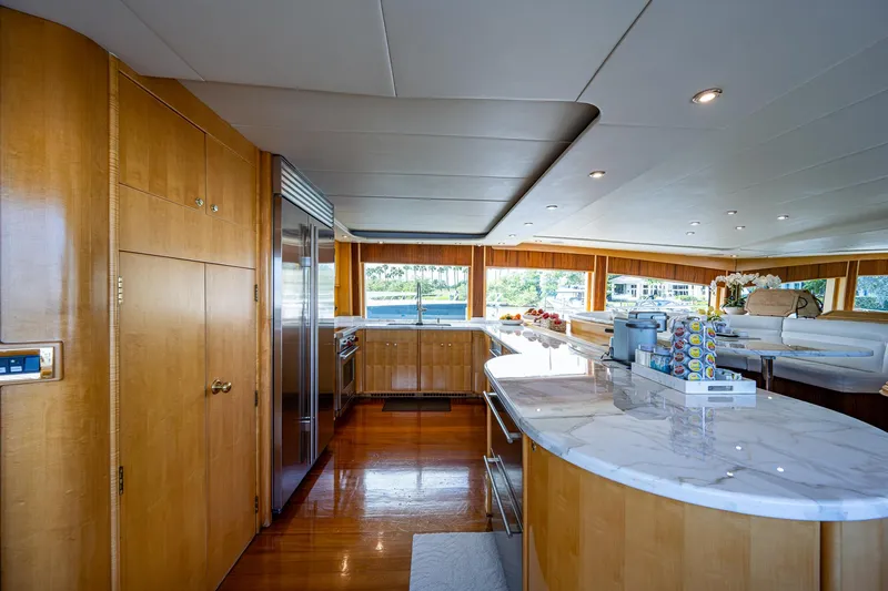 Wire We Here Yacht Photos Pics Luxurious kitchen interior of 1995 Crescent Westport Pilothouse yacht with marble countertops.