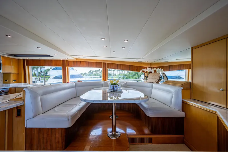 Wire We Here Yacht Photos Pics Luxurious interior of 1995 Crescent Westport Pilothouse yacht with white leather seating.