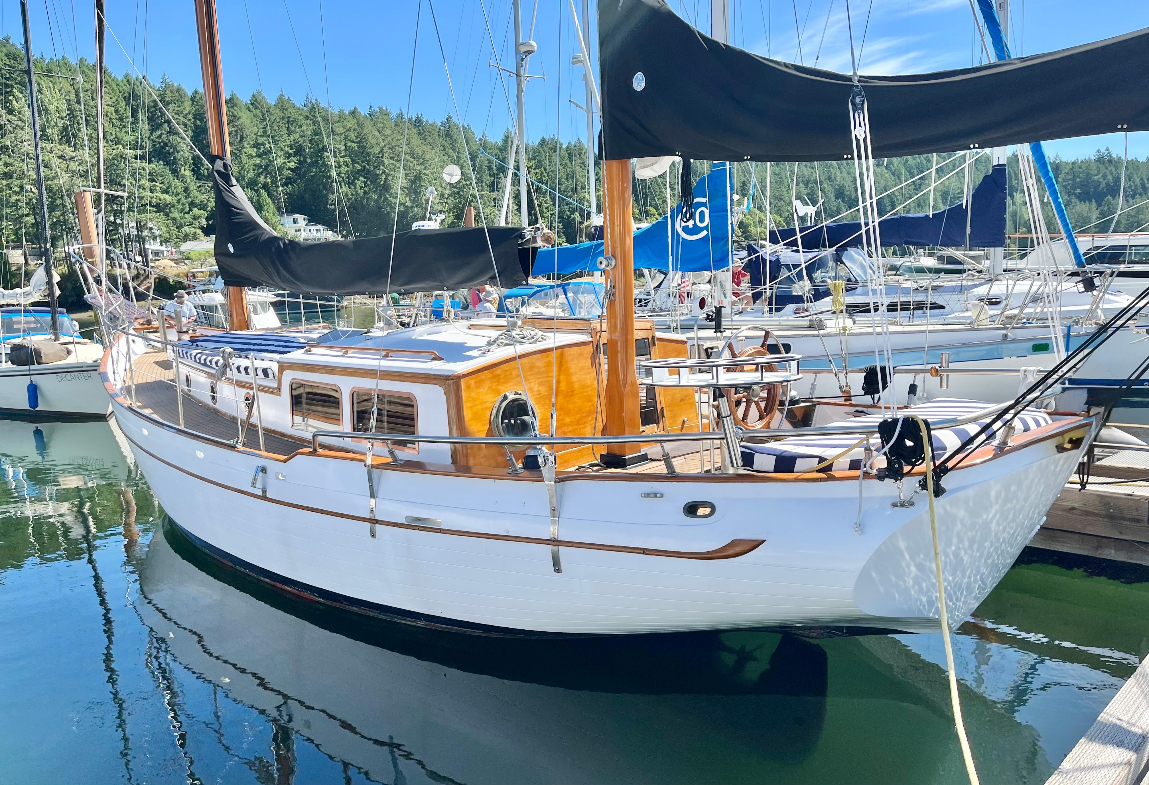 Classic 1976 CT 41 sailboat docked in a serene marina setting.
