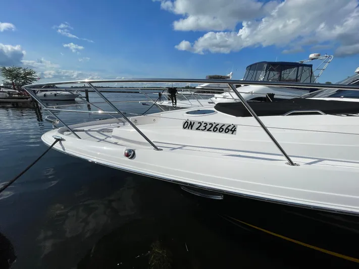  Yacht Photos Pics 2010 Regal 44 Sport Coupe yacht docked on a sunny day with clear skies.