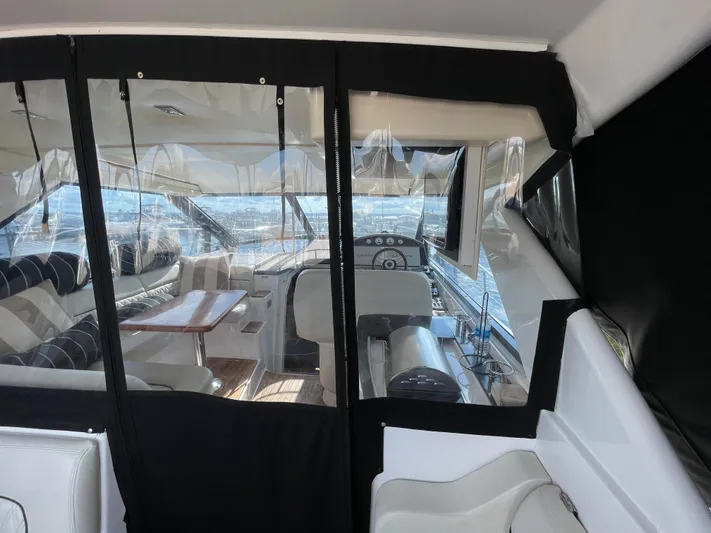  Yacht Photos Pics Interior of 2010 Regal 44 Sport Coupe yacht with seating and helm view.