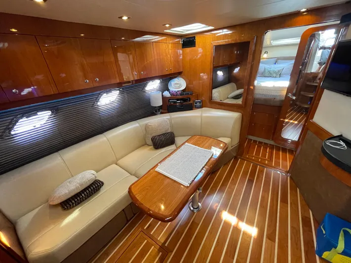  Yacht Photos Pics Luxurious interior of 2010 Regal 44 Sport Coupe yacht with elegant seating and wood finishes.